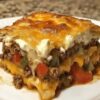 The ultimate hearty, cheesy casserole layered with beef, biscuits, veggies, and a creamy topping. Perfect for family dinners or potlucks!