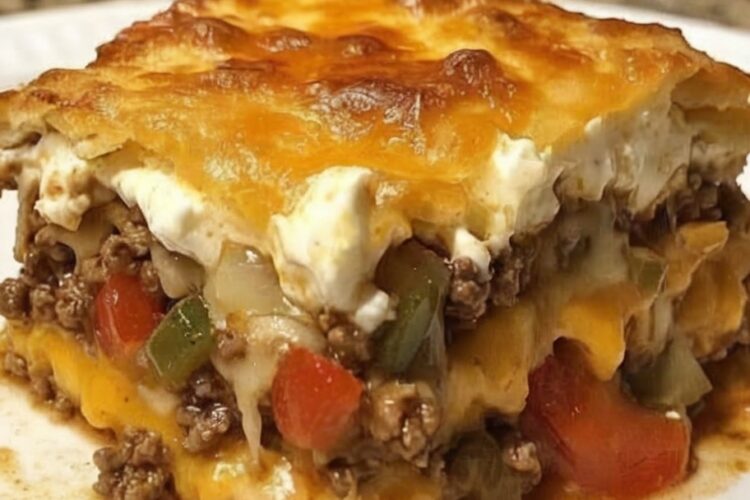 The ultimate hearty, cheesy casserole layered with beef, biscuits, veggies, and a creamy topping. Perfect for family dinners or potlucks!