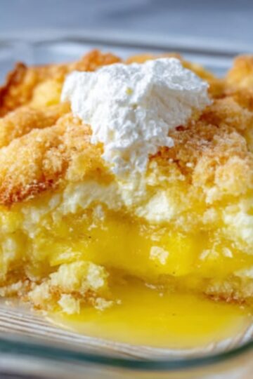 Tangy lemon and rich cream cheese layered under a golden buttery topping—an easy dessert that tastes like sunshine.