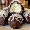 Sweet, chewy coconut centers coated in rich chocolate — a no-bake treat perfect for holidays, gifts, or anytime cravings.