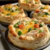 Golden, flaky, and filled with creamy chicken and veggies—these bite-sized pot pies are the ultimate comfort food made easy.