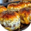 Juicy beef, melty cheese, and garlicky butter wrapped in golden crescent rolls — the ultimate game day appetizer or family dinner.