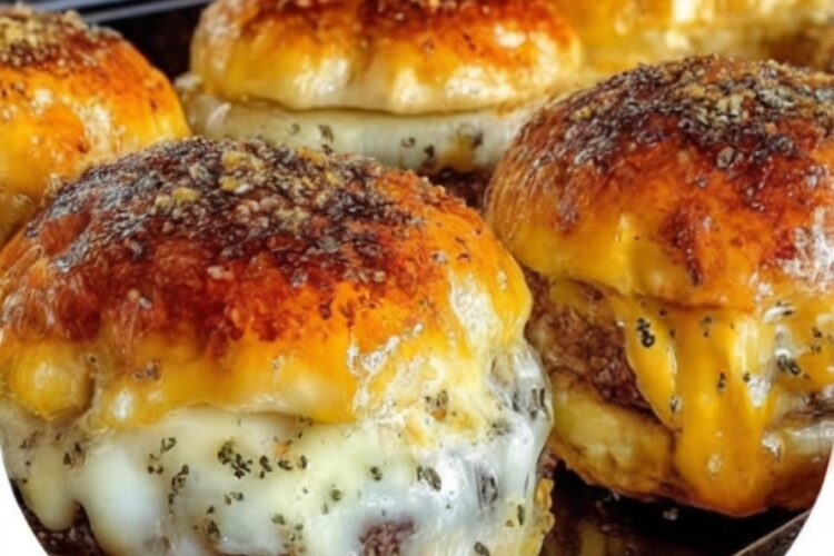 Juicy beef, melty cheese, and garlicky butter wrapped in golden crescent rolls — the ultimate game day appetizer or family dinner.