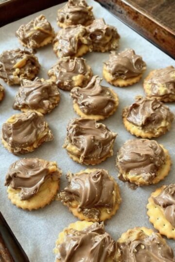 Sweet, nutty, and buttery treats made with Ritz crackers and homemade caramel pecan topping — the ultimate fall dessert with no baking required.