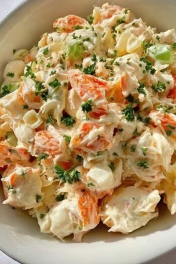 A cool, creamy, and refreshing seafood classic made with tender crab meat, crisp vegetables, and a lightly tangy dressing.