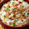 A rich, creamy, triple-cheese dip loaded with crispy bacon and baked until hot, bubbly, and irresistible — perfect for parties and comfort-food cravings.