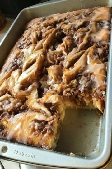 A soft, fluffy cake with rich cinnamon swirls and creamy glaze — all the comfort of cinnamon rolls without the work.