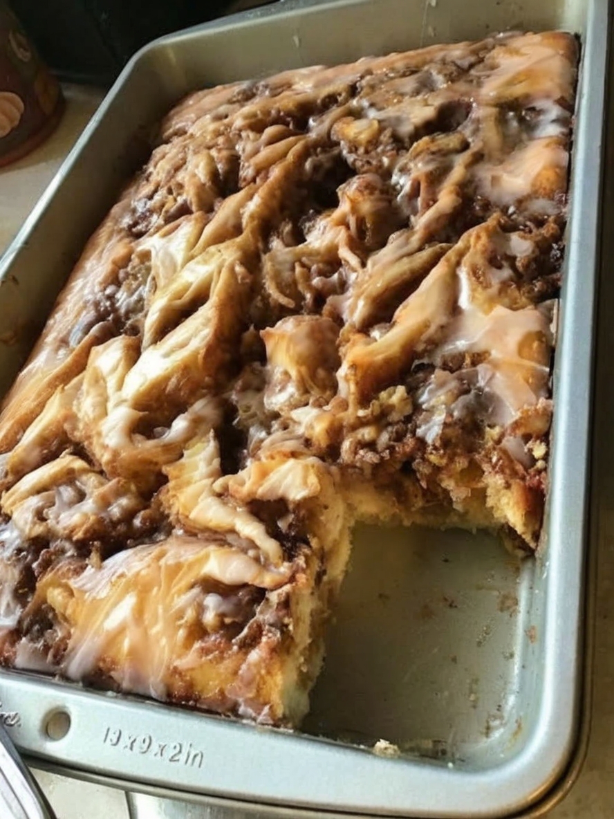 A soft, fluffy cake with rich cinnamon swirls and creamy glaze — all the comfort of cinnamon rolls without the work.