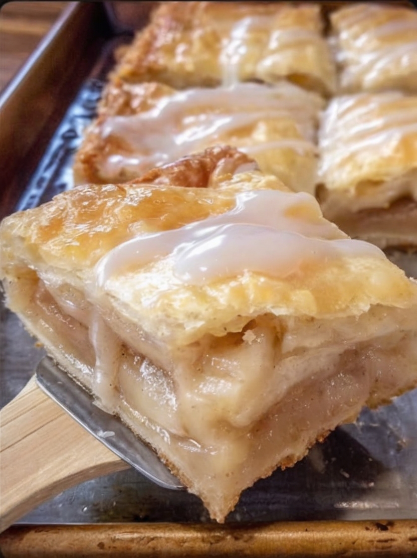 Thick, bakery-style apple slices with a crisp double crust and juicy cinnamon filling that slices clean every time.