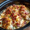 A creamy, ranch-seasoned shredded chicken made in the slow cooker with just three ingredients. Add bacon for an irresistibly savory comfort-food classic.