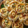 Flaky crescent dough rolled with creamy ranch chicken, bacon, and cheddar, baked until golden and irresistible. The perfect party appetizer or snack.