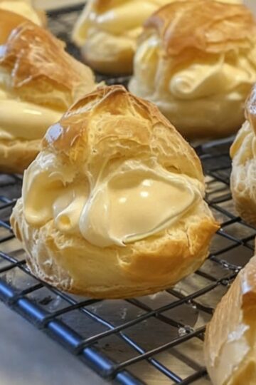 Light, flaky puff pastry filled with smooth vanilla custard and dusted with powdered sugar — an elegant dessert made simple.