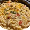 A comforting slow cooker dinner made with tender shredded chicken, creamy sauce, and spaghetti cooked right in the crockpot for maximum flavor and minimal effort.
