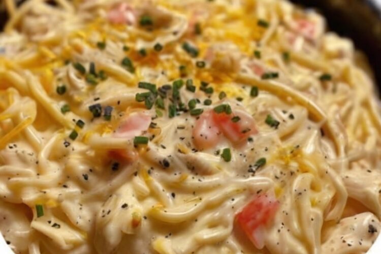 A comforting slow cooker dinner made with tender shredded chicken, creamy sauce, and spaghetti cooked right in the crockpot for maximum flavor and minimal effort.