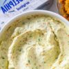 A fresh, creamy vegetable spread made with cream cheese, crisp garden vegetables, and herbs — perfect for bagels, crackers, and brunch boards.