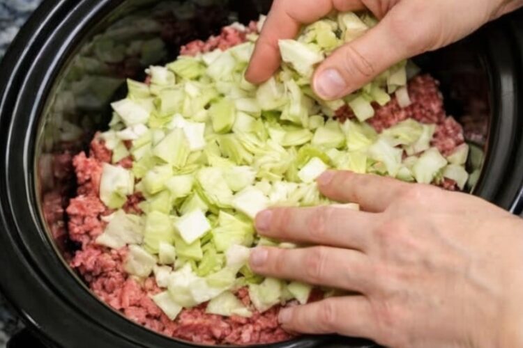 All the soul-warming comfort of stuffed cabbage rolls without any of the fussy rolling. Raw ground beef, chopped cabbage, onions, and crushed tomatoes layer in a slow cooker and transform into tender, savory perfection over hours of gentle heat. Serve over egg noodles or mashed potatoes for the ultimate comfort meal.