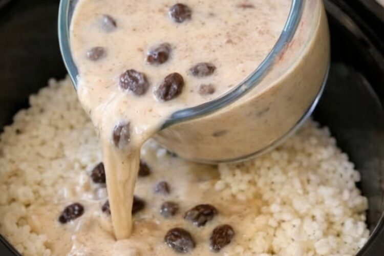 The Dessert That Made Me Believe in Slow Cooker Magic Again There's a particular kind of comfort that comes from desserts your grandmother made—the ones where sweetness and simplicity meet in a bowl that somehow tastes like being taken care of. This Slow Cooker Rice Pudding is exactly that kind of dessert. Creamy, gently sweet, warmly spiced, and so silky-smooth it practically melts on your tongue. And the best part? Your slow cooker does all the patient stirring and watching while you go about your day, transforming basic rice, milk, and sugar into something that tastes like pure nostalgia. What makes this recipe genuinely magical is how the slow, steady heat coaxes the starch from the rice grains, creating that signature creamy, almost custardy texture without you standing over a pot stirring constantly and praying it doesn't scorch. The rice softens slowly, the milk reduces and thickens, the cinnamon infuses everything with warmth, and you come back hours later to a pot of pure comfort. Serve it warm right from the slow cooker, or chill it for a firmer, pudding-like texture the next day. Either way, it's the kind of dessert that makes everything feel right—like someone who loves you just handed you a bowl of sweetness and told you to rest. Why You'll Love This Recipe Practically makes itself with gentle, hands-off slow cooker heat No constant stirring or watching to prevent scorching Creamy, silky texture from slow-released rice starches Simple pantry ingredients you probably already have Warmly spiced with cinnamon and vanilla Endlessly customizable with your favorite add-ins Perfect warm or cold—two desserts in one Great for meal prep—tastes even better the next day Kid-friendly comfort food that appeals to all ages Makes your kitchen smell like a warm hug Ingredients ¾ cup uncooked white rice (short or medium grain works best) 4 cups whole milk 1 cup heavy cream (for extra richness) ½ cup granulated sugar 1 teaspoon vanilla extract ½ teaspoon ground cinnamon Pinch of salt ½ cup raisins (optional) Optional Toppings: Extra cinnamon Fresh berries Toasted nuts Caramel sauce Whipped cream Equipment 4-6 quart slow cooker Fine mesh strainer (for rinsing rice) Measuring cups and spoons Wooden spoon or spatula Serving bowls Step-by-Step Instructions Step 1: Rinse Your Rice Place the rice in a fine mesh strainer and rinse it thoroughly under cold running water, swishing it around with your fingers until the water runs clear. This removes excess surface starch that can cause clumping and helps the rice cook more evenly. Drain well and shake off any excess water. Step 2: Combine Everything in the Slow Cooker Add the rinsed rice directly to your slow cooker. Pour in the milk and heavy cream, then add the sugar, cinnamon, and a pinch of salt. Stir everything together gently until the sugar dissolves and everything is evenly combined. The mixture will look thin now—that's exactly right. The magic happens slowly over the next few hours. Step 3: Cook Low and Slow Put the lid on your slow cooker and set it to LOW for 2½ to 3 hours. If you're around and can manage it, stir once or twice during cooking to ensure even texture and prevent any rice from sticking to the bottom, but it's not absolutely necessary. The pudding is done when the rice is completely tender and the mixture has thickened to a creamy consistency that coats the back of a spoon. It should still look slightly loose and pourable—it will continue to thicken dramatically as it cools. Step 4: Add Vanilla and Optional Raisins During the final 10-15 minutes of cooking, stir in the vanilla extract. This is also when you add raisins if you're using them—adding them during the last 30 minutes gives them time to plump up and soften without turning to mush. Stir gently to distribute everything evenly. Step 5: Check Consistency and Rest Turn off the slow cooker and let the pudding rest for about 10 minutes with the lid off. It will thicken noticeably as it sits. If it looks too thick at this point, stir in a splash of warm milk to loosen it to your preferred consistency. Remember: rice pudding continues to thicken as it cools, so err on the side of slightly looser while it's hot. Step 6: Serve with Love Spoon into bowls and serve warm, at room temperature, or chilled—it's delicious at any temperature. Top with a dusting of extra cinnamon, fresh berries, toasted nuts, a drizzle of caramel, or whatever makes your heart happy. Pro Tips Use short or medium grain rice. These varieties release more starch as they cook, creating that signature creamy texture. Long grain rice stays too separate and won't give you the same creaminess. Don't skip rinsing the rice. It prevents clumping and helps achieve an even, smooth texture. Stir once or twice if you can. This isn't mandatory, but a gentle stir halfway through ensures even cooking and prevents any rice from sticking. The pudding will thicken as it cools. Always make it slightly looser than you think you want—it firms up significantly in the refrigerator. Add a tablespoon of butter at the end. This creates an even silkier, more luxurious texture. Warm your milk additions. If you need to thin the pudding after it cools, use warm milk rather than cold so it incorporates smoothly. Variations & Substitutions Spiced version: Add ½ teaspoon of nutmeg, ¼ teaspoon of cardamom, or a whole cinnamon stick (remove before serving). Citrus twist: Stir in 1 tablespoon of orange or lemon zest during the last 15 minutes for bright, fresh flavor. Coconut rice pudding: Replace 2 cups of the milk with coconut milk and garnish with toasted coconut flakes. Make it dairy-free: Use coconut milk or almond milk throughout, though the texture will be slightly different. Caramel rice pudding: Drizzle warm caramel sauce over each serving. Berry swirl: Stir in raspberry or strawberry compote at the end for pockets of fruity sweetness. Chocolate rice pudding: Stir in ⅓ cup of cocoa powder and increase sugar to ⅔ cup. Make it lower sugar: Reduce sugar to ⅓ cup—it will be less sweet but still delicious. Serving, Pairing & Storage How to Serve: Rice pudding is incredibly versatile. Serve it warm right from the slow cooker for the ultimate comfort food experience, or chill it overnight for a firmer, pudding-like texture. Top with fresh berries, toasted almonds or pecans, a sprinkle of cinnamon, a drizzle of honey or caramel, or a dollop of whipped cream. What It Pairs Well With: This works beautifully as dessert after any meal, but it's also lovely as a sweet breakfast or afternoon snack. Pair with strong black coffee, chai tea, or a glass of cold milk. Storage: Store leftovers in an airtight container in the refrigerator for up to 4 days. The pudding will thicken considerably when chilled—this is completely normal and many people actually prefer the firmer texture. Freezing Instructions: Rice pudding freezes surprisingly well! Store in freezer-safe containers for up to 2 months. Thaw overnight in the refrigerator and stir well before serving. You may need to add a splash of milk to restore creaminess. Reheating Tips: Reheat gently on the stovetop over low heat or in the microwave, stirring in a splash of milk to loosen it back to your desired consistency. Heat just until warm—don't boil or it can become grainy. FAQ What type of rice works best? Short or medium grain white rice releases the most starch and creates the creamiest texture. Arborio (risotto rice) works beautifully. Long grain rice will be less creamy and more separate. Can I use brown rice? You can, but you'll need to increase the cooking time to 4-5 hours on LOW and add an extra cup of liquid. The texture will be chewier and less creamy. Why is my rice pudding watery? It probably needs more time. Cook it longer, uncovered if necessary, until it reaches your desired thickness. Remember it will thicken significantly as it cools. Why is my rice pudding too thick? Rice pudding thickens dramatically as it cools. If it's too thick after chilling, simply stir in warm milk a tablespoon at a time until it reaches your preferred consistency. Can I make this without heavy cream? Yes, you can use 5 cups of whole milk instead of 4 cups milk plus 1 cup cream. It will be slightly less rich but still delicious. When should I add the vanilla? Add it during the last 10-15 minutes of cooking. Adding it too early causes the delicate vanilla flavor to cook off.