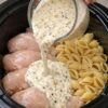 The ultimate dump-and-go dinner: raw chicken breasts and dry pasta shells slow-cooked in a rich, garlicky Parmesan cream sauce. One mixture, one slow cooker, and a few hours later you have silky, tender, deeply flavorful pasta that tastes like it took all day.