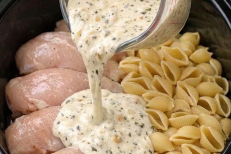 The ultimate dump-and-go dinner: raw chicken breasts and dry pasta shells slow-cooked in a rich, garlicky Parmesan cream sauce. One mixture, one slow cooker, and a few hours later you have silky, tender, deeply flavorful pasta that tastes like it took all day.