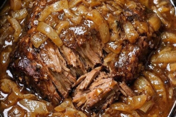 The ultimate set-and-forget dinner: chuck roast, onion soup mix, sliced onions, and beef broth transform into fall-apart tender pot roast with sweet caramelized onions and rich, glossy gravy. No searing, no babysitting—just layer, pour, and walk away for 9 hours. Comfort food at its finest.