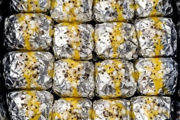 Individually foil-wrapped russet potatoes steamed to fork-tender perfection in the slow cooker, then stuffed with molten sharp cheddar and crispy bacon. Each potato gets infused with butter and seasonings during the long, gentle cook, then finished with a gooey cheese-and-bacon center. The ultimate hands-off side dish with dramatic tableside appeal.