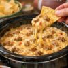 The ultimate party dip that causes actual crowds to form: browned sausage, cream cheese, Rotel, and shredded cheese melt together into molten, savory, perfectly spiced perfection. Dump it in the slow cooker and walk away—it stays warm and dippable for hours.