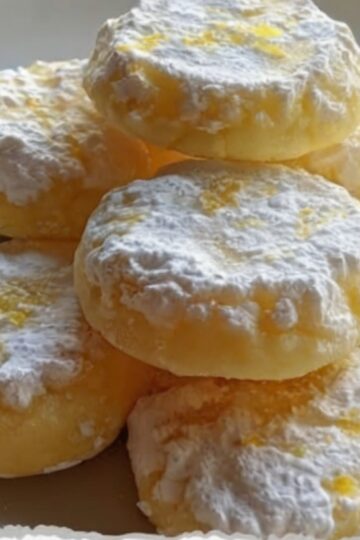 Delicate, buttery cookies with bright fresh lemon flavor that literally melt in your mouth. Butter and powdered sugar creamed until fluffy, mixed with lemon zest and juice, then combined with just enough flour to hold together. Baked until barely golden and dusted with snowy powdered sugar. Tender, crumbly, elegant cookies perfect for tea time or gifts.