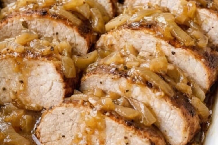 Fork-tender boneless pork loin roasted low and slow beneath a blanket of cream of mushroom soup and onion soup mix. No searing, no browning, no multiple steps—just season, cover tightly, and bake until the meat is so tender you can slice it with a spoon. Rich, savory gravy develops automatically.