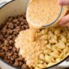 The ultimate one-pot comfort dinner: ground beef browned with onions and garlic, then uncooked pasta shells and a creamy tomato sauce poured right on top. Everything simmers together until the pasta is tender and coated in velvety, cheesy sauce. Ready in 35 minutes with minimal cleanup.