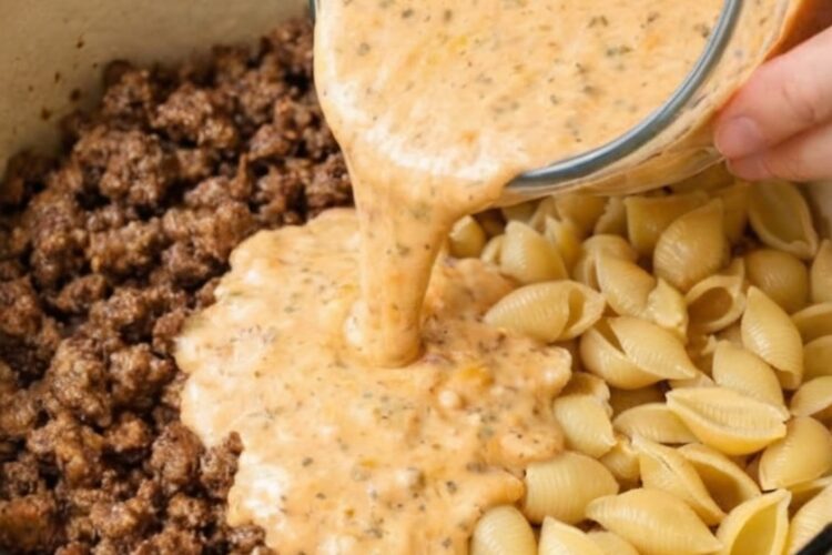 The ultimate one-pot comfort dinner: ground beef browned with onions and garlic, then uncooked pasta shells and a creamy tomato sauce poured right on top. Everything simmers together until the pasta is tender and coated in velvety, cheesy sauce. Ready in 35 minutes with minimal cleanup.