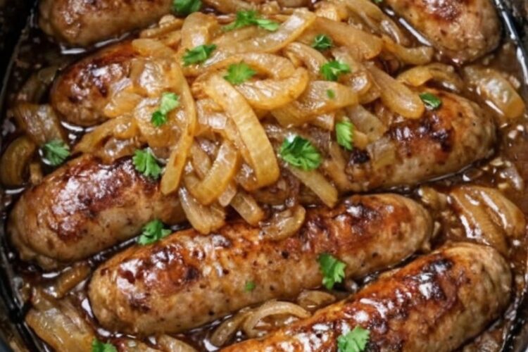 Irish-style comfort food: plump pork sausages slow-cooked over caramelized onions in rich beef stock and Worcestershire sauce. The onions melt into sweet, jammy silk and naturally thicken the gravy without flour. Set it in the morning, come home to incredible aromas. Perfect over mashed potatoes or with crusty bread.