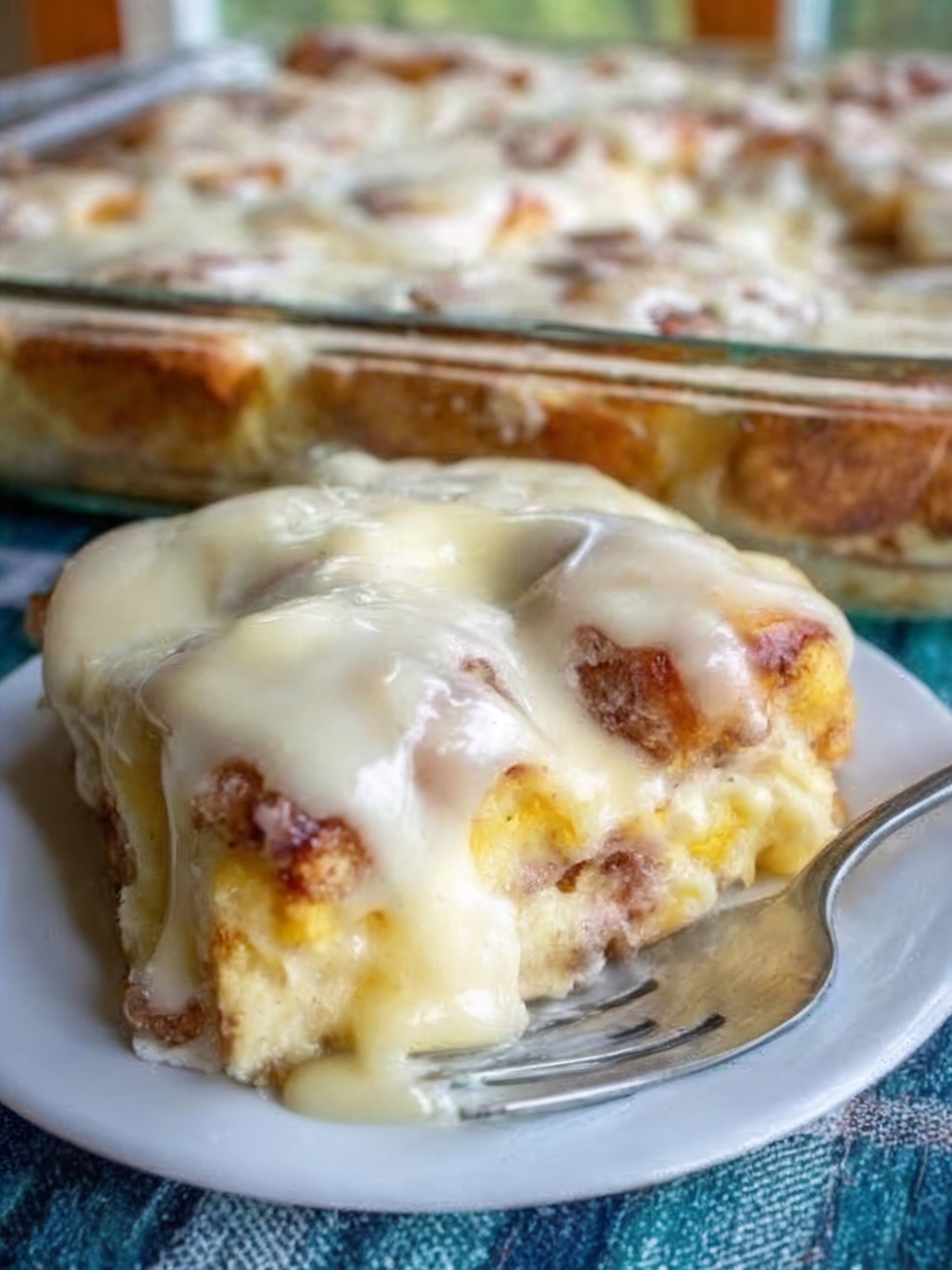The ultimate make-ahead breakfast: refrigerated orange rolls cut into quarters, soaked overnight in a custard of eggs, cream, brown sugar, fresh orange juice and zest, then baked until golden with soft, custardy centers. Topped with homemade orange icing. All the flavor of homemade sweet rolls with 5 minutes of prep the night before.