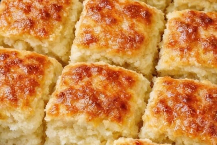 No-roll, no-cut Southern biscuits made by pouring simple batter over melted butter. Butter melted in pan, then batter (self-rising flour, milk, sugar) poured over it, scored into squares, and baked until tall, fluffy, and golden. The butter creates crispy bottoms while keeping centers soft and tender. Ready in 30 minutes with foolproof technique.