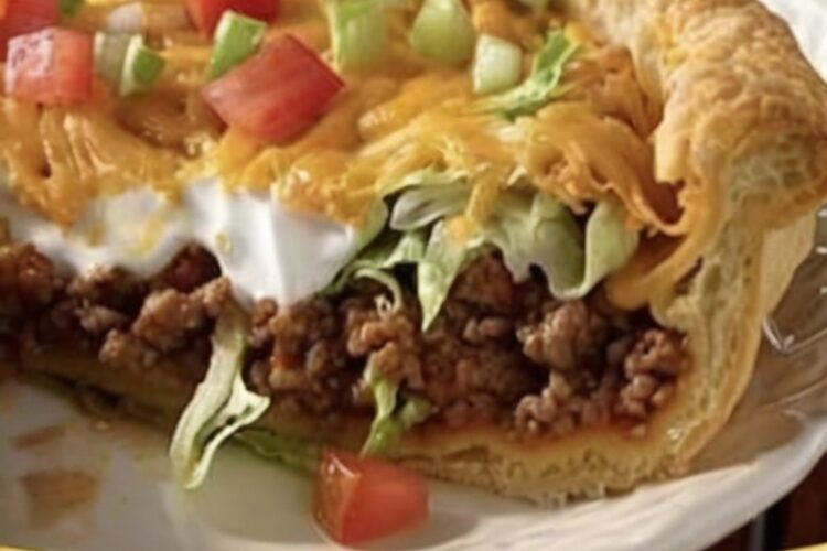 A quick and easy casserole made with flaky crescent dough, seasoned beef, and melted cheese for a comforting and flavorful dinner.