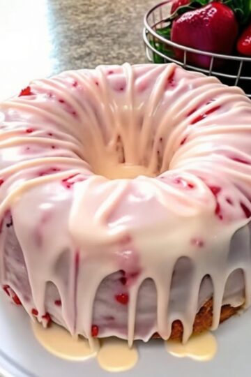 A rich, buttery, and moist pound cake with sweet strawberries and a hint of tangy cream cheese — the perfect easy homemade dessert for any occasion.