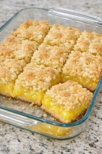 A quick and easy dessert made with lemon cake mix, pie filling, and butter, delivering a perfect balance of sweet and tangy flavors.