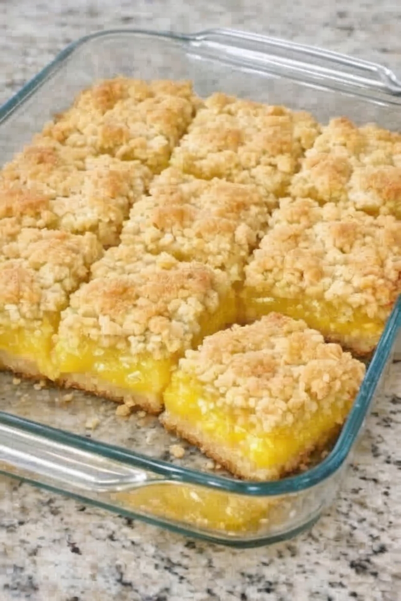 A quick and easy dessert made with lemon cake mix, pie filling, and butter, delivering a perfect balance of sweet and tangy flavors.