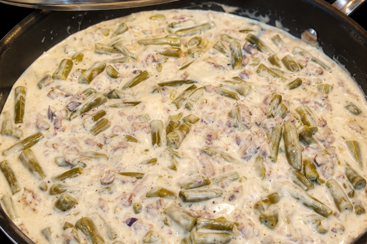 An easy one-pan ground beef and green bean dinner in a creamy mushroom sauce topped with melted cheddar. Perfect comfort food for busy weeknights.