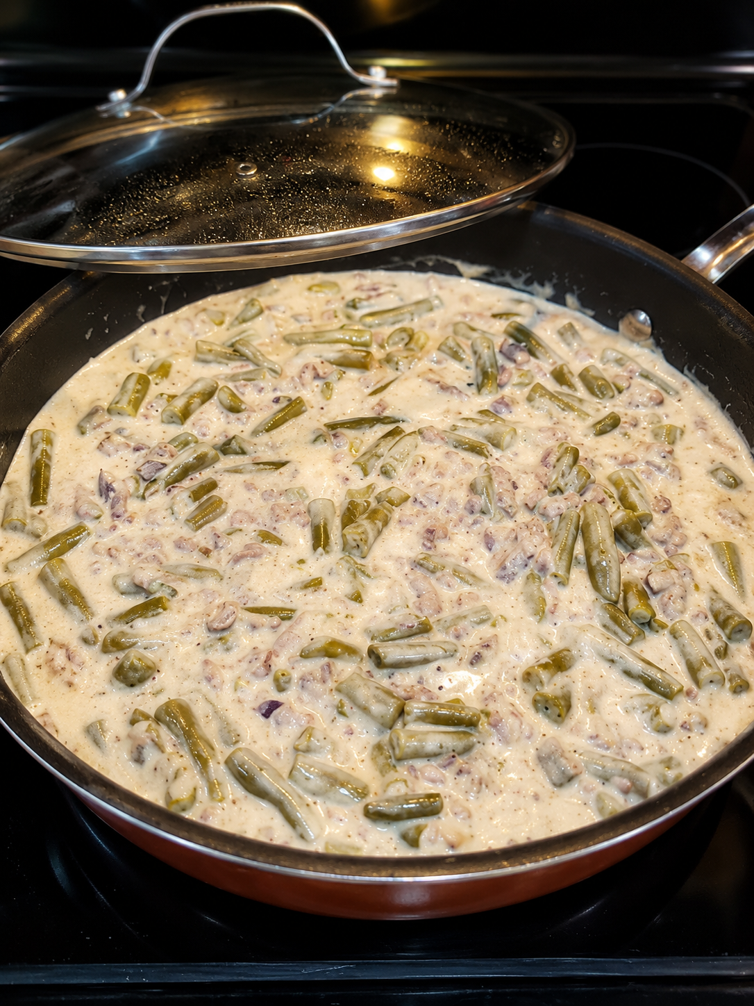 An easy one-pan ground beef and green bean dinner in a creamy mushroom sauce topped with melted cheddar. Perfect comfort food for busy weeknights.