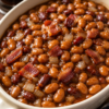 Smoky-sweet baked beans made with root beer, bacon, and brown sugar. The ultimate BBQ side dish for cookouts and summer gatherings.