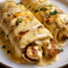 An easy baked chicken dinner made with rotisserie chicken, soft flour tortillas, and a rich garlic cream cheese sauce. Perfect for busy weeknights.
