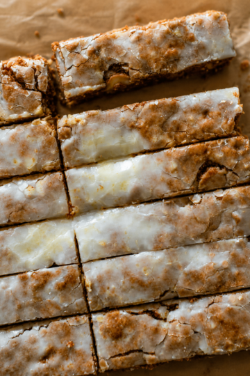 Soft and chewy German honey spice bars with cinnamon, cloves, nutmeg, toasted nuts, and a sweet vanilla glaze. Perfect for Christmas baking and holiday gifting.