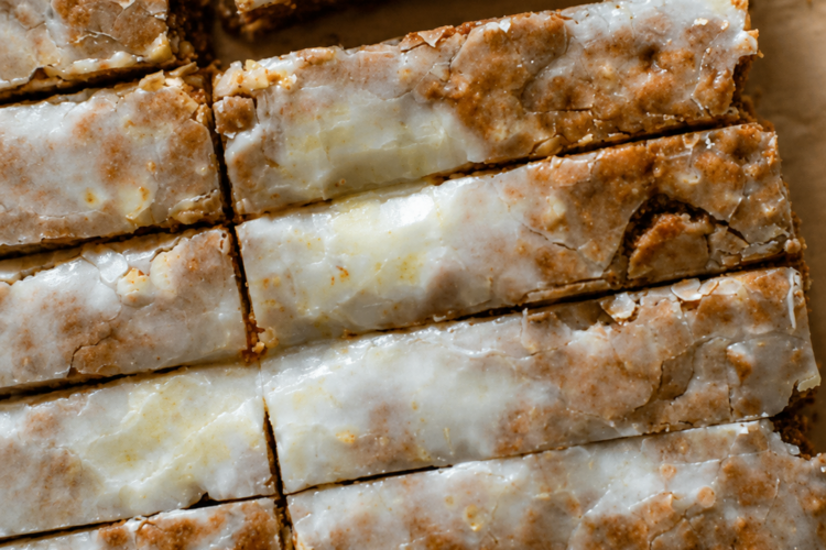 Soft and chewy German honey spice bars with cinnamon, cloves, nutmeg, toasted nuts, and a sweet vanilla glaze. Perfect for Christmas baking and holiday gifting.