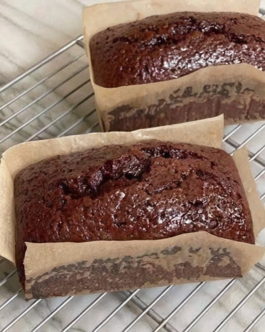 A rich, moist chocolate loaf cake made with cocoa powder and hot coffee for deep chocolate flavor. Perfect for slicing and serving anytime.