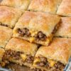 A quick and easy 4-ingredient baked casserole layered with flaky crescent dough, seasoned ground beef, and melted cheddar cheese. Perfect for busy weeknight dinners, potlucks, and comfort food cravings