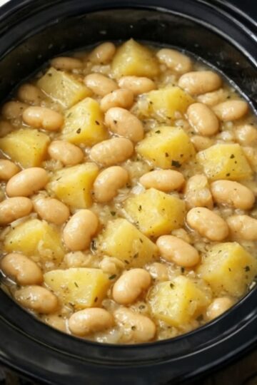 A simple, budget-friendly slow cooker comfort meal made with white beans, tender potatoes, and buttery broth. Perfect for busy weeknights, meal prep, and cozy family dinners.