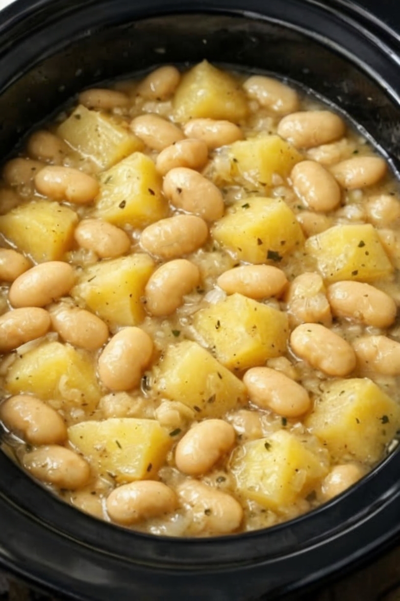 A simple, budget-friendly slow cooker comfort meal made with white beans, tender potatoes, and buttery broth. Perfect for busy weeknights, meal prep, and cozy family dinners.