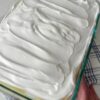 A creamy, nostalgic layered dessert featuring banana cake, crushed pineapple, sweet cream cheese pudding filling, and whipped topping. Perfect for church gatherings, holiday potlucks, and make-ahead entertaining.
