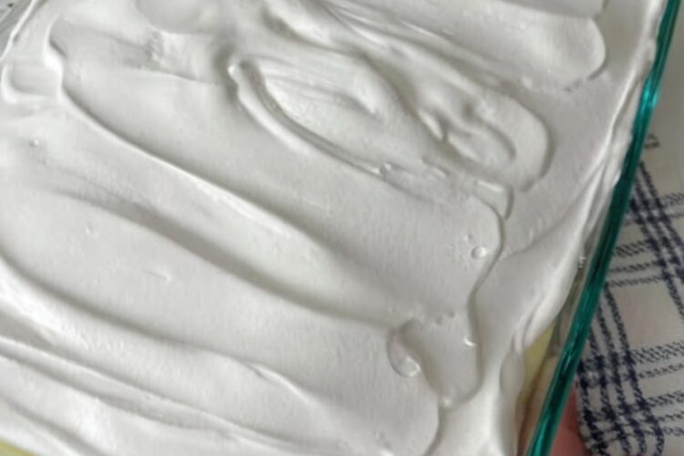 A creamy, nostalgic layered dessert featuring banana cake, crushed pineapple, sweet cream cheese pudding filling, and whipped topping. Perfect for church gatherings, holiday potlucks, and make-ahead entertaining.