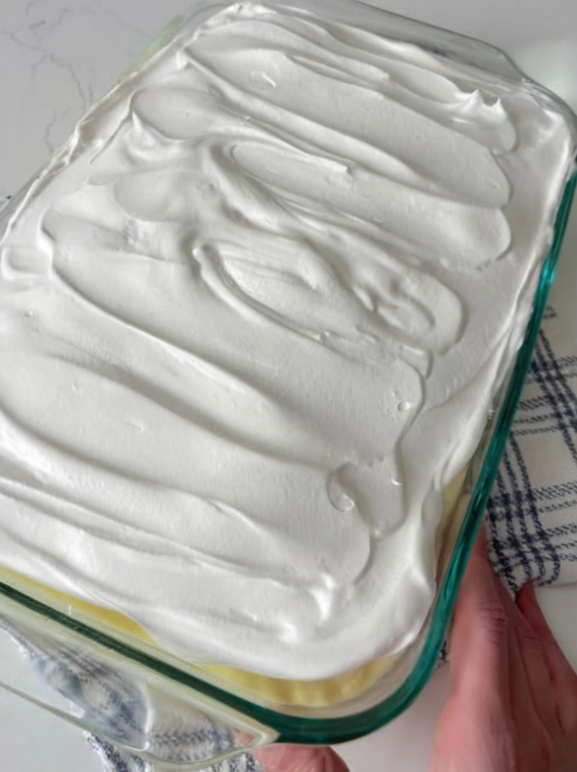 A creamy, nostalgic layered dessert featuring banana cake, crushed pineapple, sweet cream cheese pudding filling, and whipped topping. Perfect for church gatherings, holiday potlucks, and make-ahead entertaining.